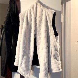 A white fur vest